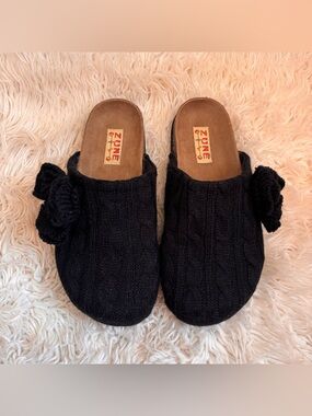 Black cable knit mules with ruffle detail